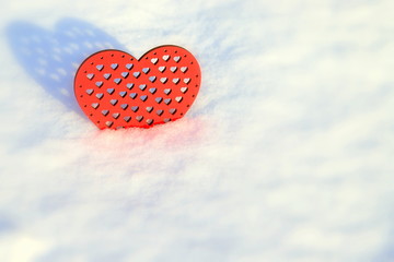 Fototapeta premium Valentines Day red heart in winter. Red wooden heart in the snow , winter scene with love message.