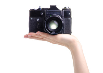 Photo camera old in hands on white background isolation