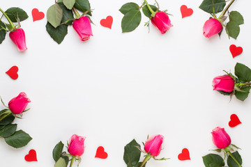 Flowers composition. Frame made of red rose on white background. Flat lay, top view, copy space.