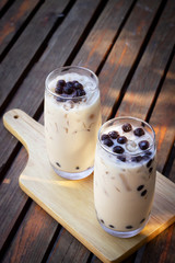 Bubble milk tea in glass. Trendy beverage in Asia. Sweet drink with tapioca.