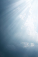 Fototapeta premium Rays of light come through the dark clouds before the rain