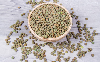 Green lentils - legume seeds with a high content of vegetable protein. Conception of healthy eating.
