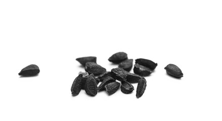 black cumin seeds macro isolated on white background