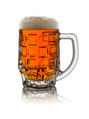 glass mug with dark beer and foam on a white background with reflection