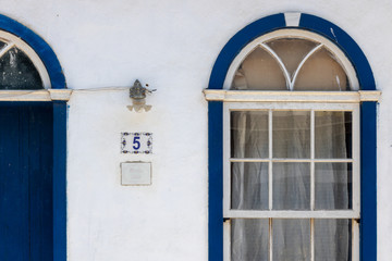 window with blue shutters