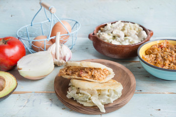 Arepas with reina pepiada and egg revueltos