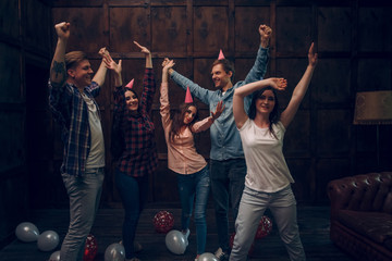 Group of friends dance at birthday party