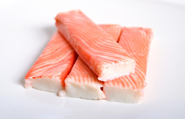 Crab sticks, krab sticks, imitation crab meat or seafood sticks. Isolated on white. © spline_x