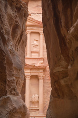 The first glimpse of Petra Treasury (Al-Khazneh) upon exiting Siq in  Petra, Jordan