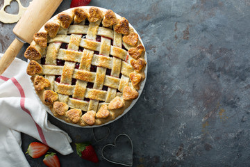 Strawberry pie with lattice and heart shaped decoration for Valentines Day