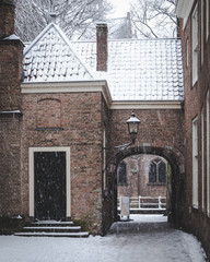 Old gate from Prinsenhof to Old Church, Oude Kerk in Delft