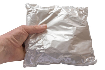 White postal package in the hand of man