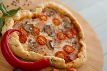Pizza heart shaped on wood