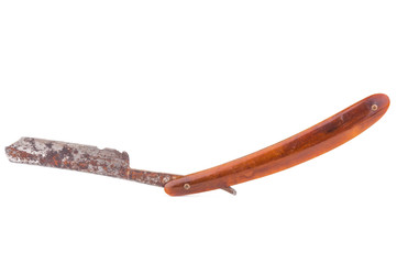 Dirty vintage straight razor on white background