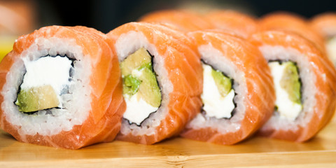 Overhead japanese sushi food. Maki ands rolls with tuna, salmon, shrimp, crab and avocado. Top view of assorted sushi, all you can eat menu. Rainbow sushi roll, uramaki, hosomaki and nigiri.