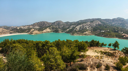 Fototapeta na wymiar Gecitkoy (Dagdere) dam with turquoise water near Kyrenia, Northern Cyprus.