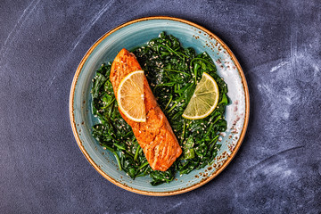Grilled salmon with spinach.