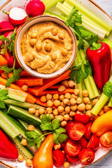 Hummus with various fresh raw vegetables.