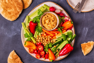 Hummus with various fresh raw vegetables.