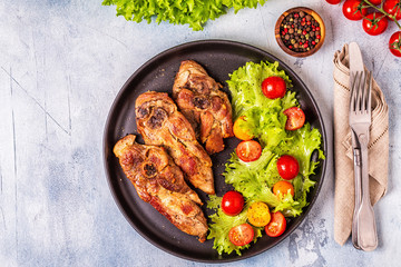 Roasted turkey steak with salad.