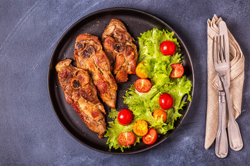 Roasted turkey steak with salad.