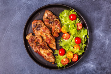 Roasted turkey steak with salad.