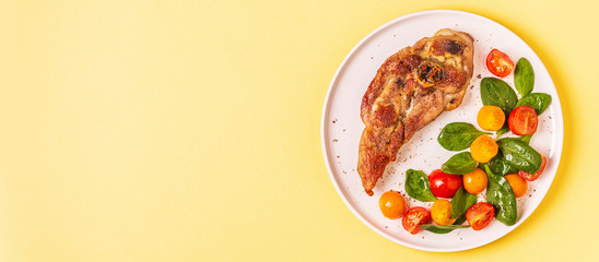 Roasted turkey steak with salad.