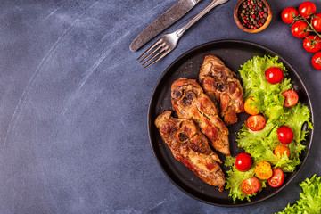 Roasted turkey steak with salad.