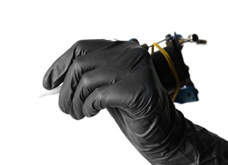 Professional tattoo artist with machine on white background, closeup