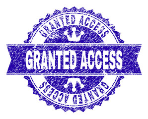 GRANTED ACCESS rosette stamp watermark with grunge texture. Designed with round rosette, ribbon and small crowns. Blue vector rubber watermark of GRANTED ACCESS caption with retro texture.