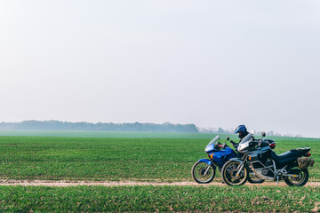 Two Motorbike and motorcyclist on off road, enduro, extreme mood, active lifestyle, adventure touring concept, outdoor trailway, dual sport. discover the world on motorcycle