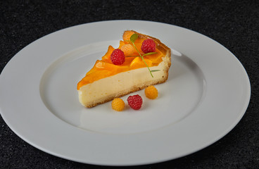 A slice of Cheesecake served with berries 