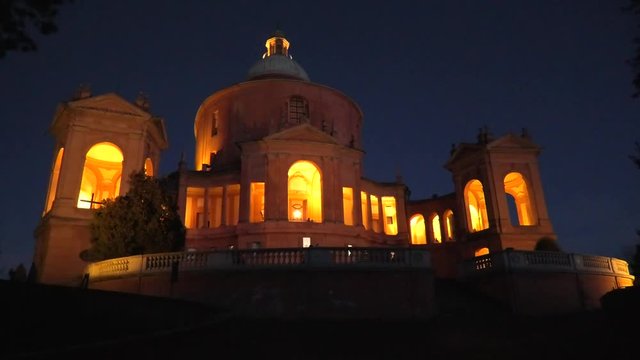 Pronaos and facade of Sanctuary of Madonna di San Luca at dark. Basilica church of San Luca in Bologna, Emilia-Romagna, Italy illuminated by night. Famous landmark cityscape.