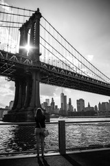 Manhattan Bridge NYC with sun flare through the bridge