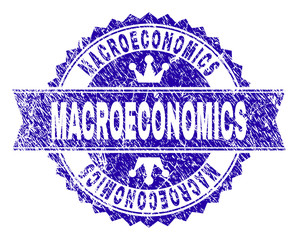 MACROECONOMICS rosette stamp imprint with grunge style. Designed with round rosette, ribbon and small crowns. Blue vector rubber print of MACROECONOMICS label with grunge style.