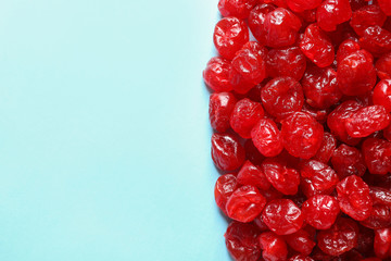 Cherries on color background, top view with space for text. Dried fruit as healthy snack