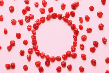 Frame of cherries on color background, top view with space for text. Dried fruit as healthy snack