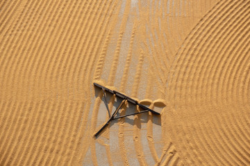 tractor flattening cracked wheat for drying