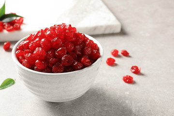 Bowl of sweet cherries on table, space for text. Dried fruit as healthy snack