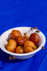 Bees attracted to honey puffs at Greek Festival