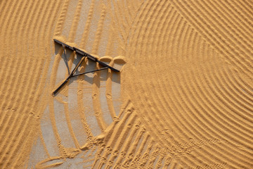 tractor flattening cracked wheat for drying