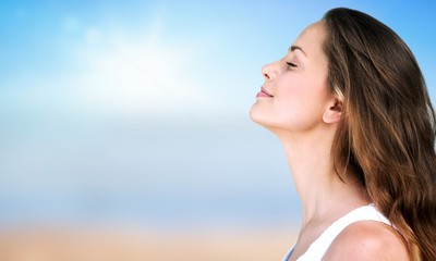 Outdoor summer portrait of pretty young smiling happy woman