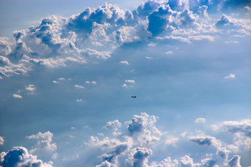 Airplane flying in sky view from window of another aircraft