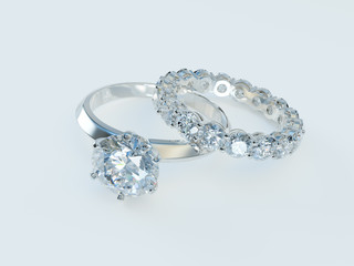 Solitaire diamond engagement ring, eternity ring on white background