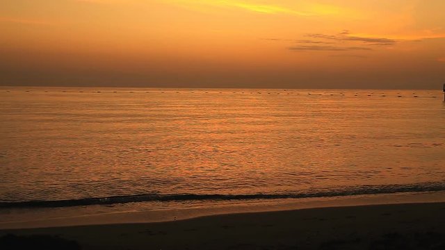 Girl runs at dawn along the seashore