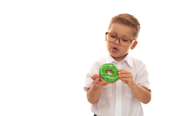 Little cute boy in a white shirt and glasses