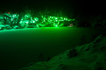 Illiminated Marble Canyon in Karelia in winter. Green.