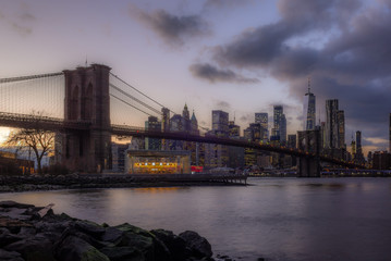 View of the Brooklyn Bridge and Manhattan from the riverside of the East River at sunset - 9
