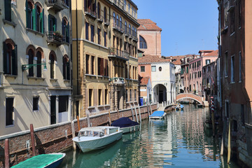 Fototapeta na wymiar Historical canal and bridge in Venice, Italy