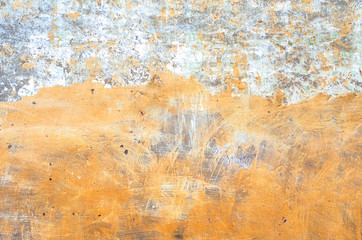 Old house wall with plaster and washed out paint as a rustic background